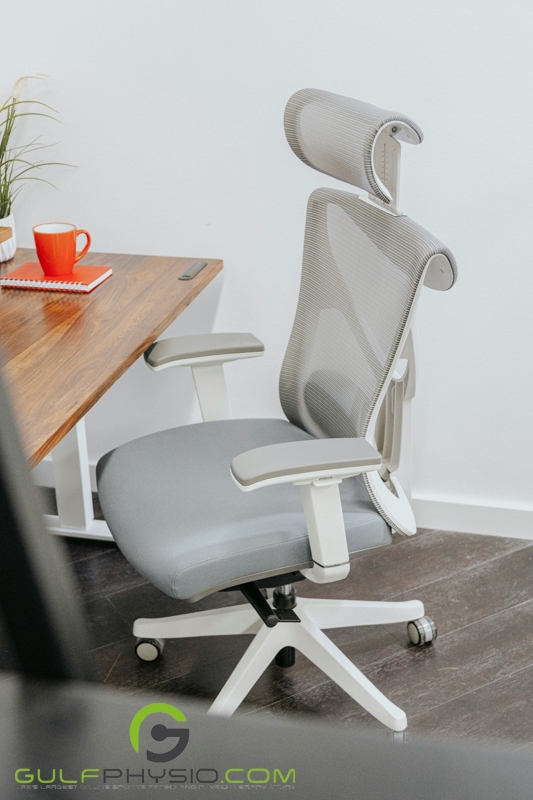 An ergonomic office chair in a home office setup.