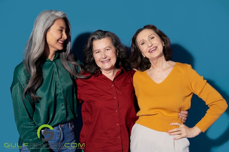 A group of older women smiling at the camera.