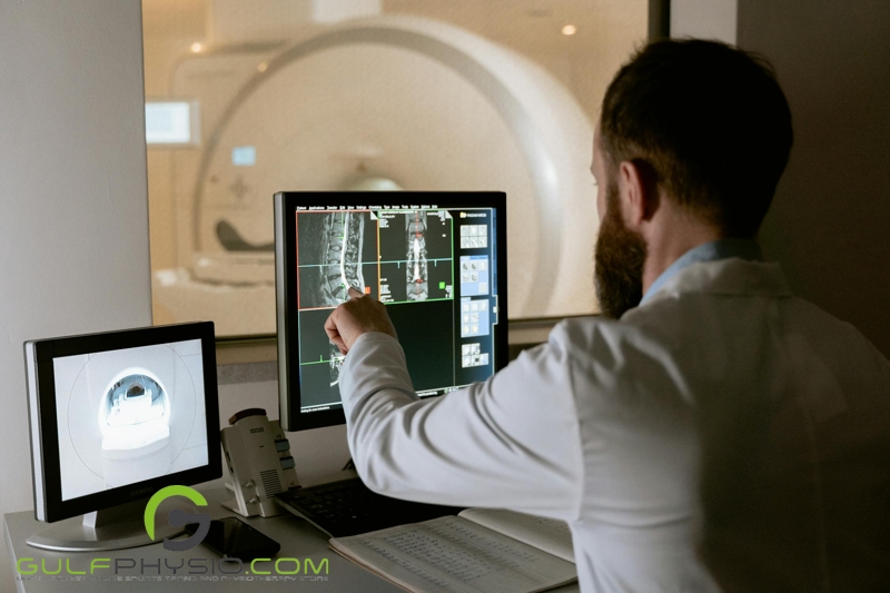 A doctor examines an ongoing MRI scan of a patient.